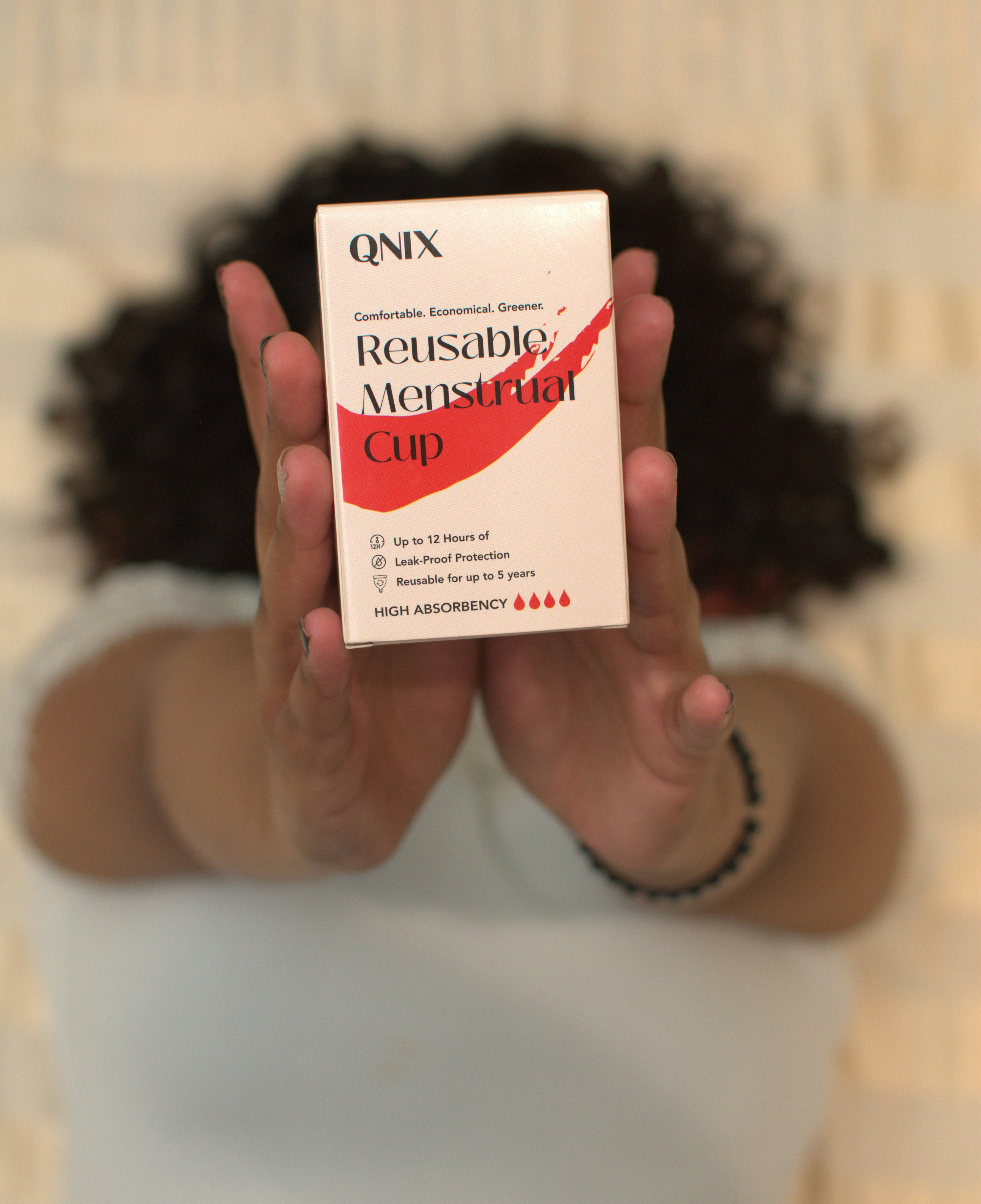 Woman holding sanitary product